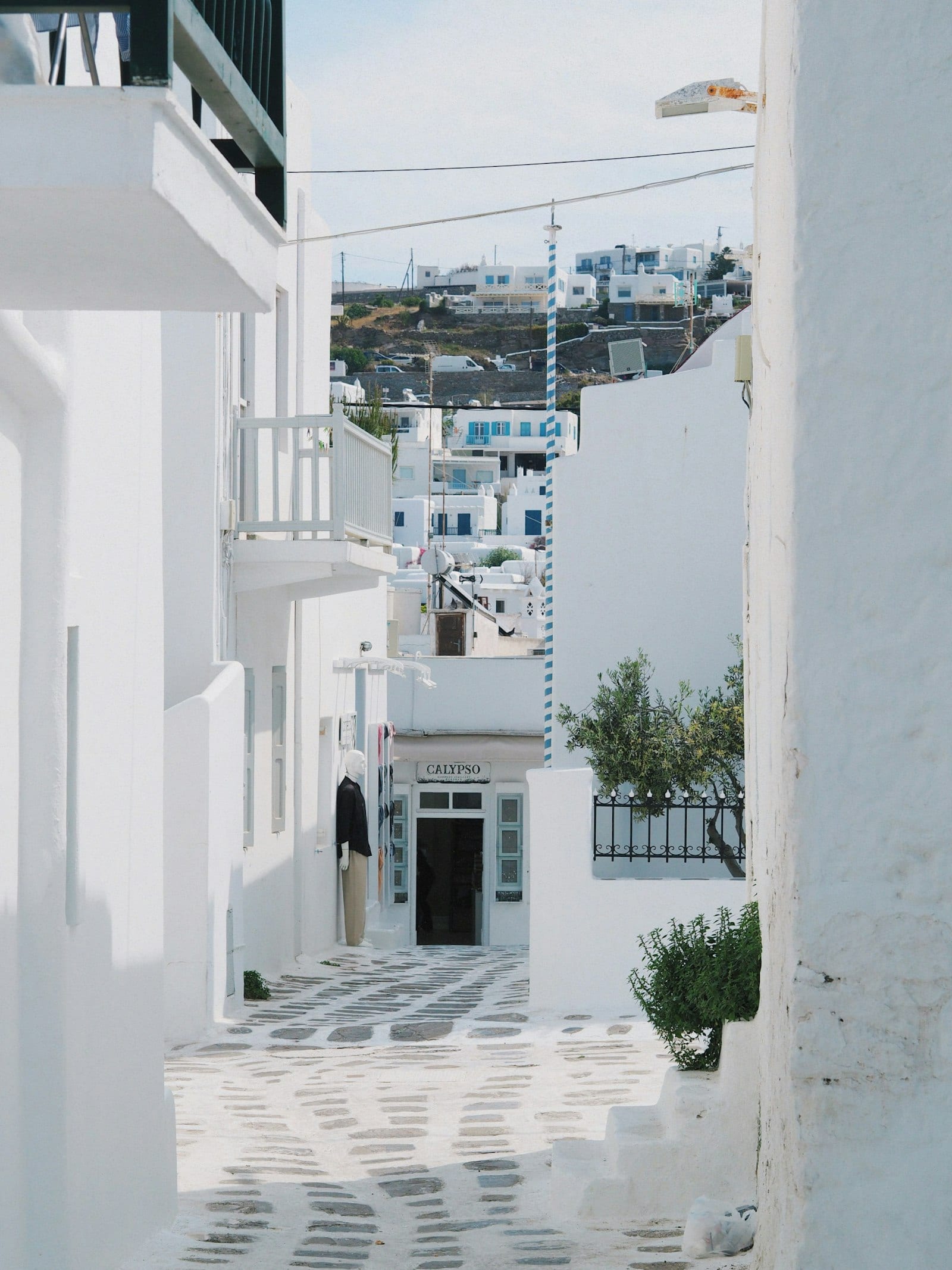 Narrow whitewashed pedestrian lane in Mykonos Town